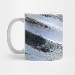 Close-up of beautiful layered triangular stone rock in white and grey stripes Mug